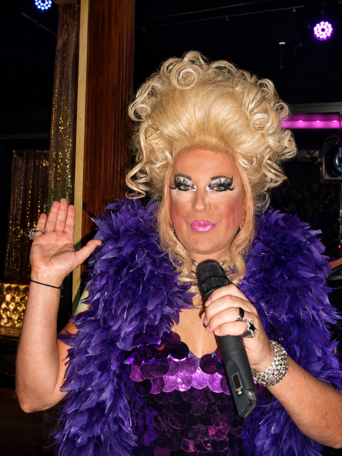 Anthony Larkin performing in a dramatic purple costume