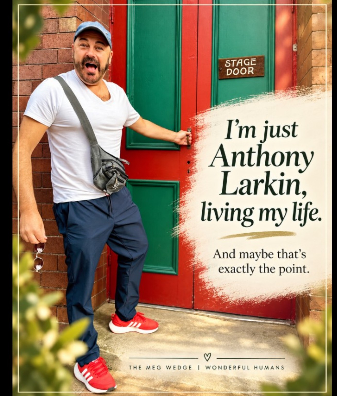 Anthony Larkin standing cheerfully beside a stage door